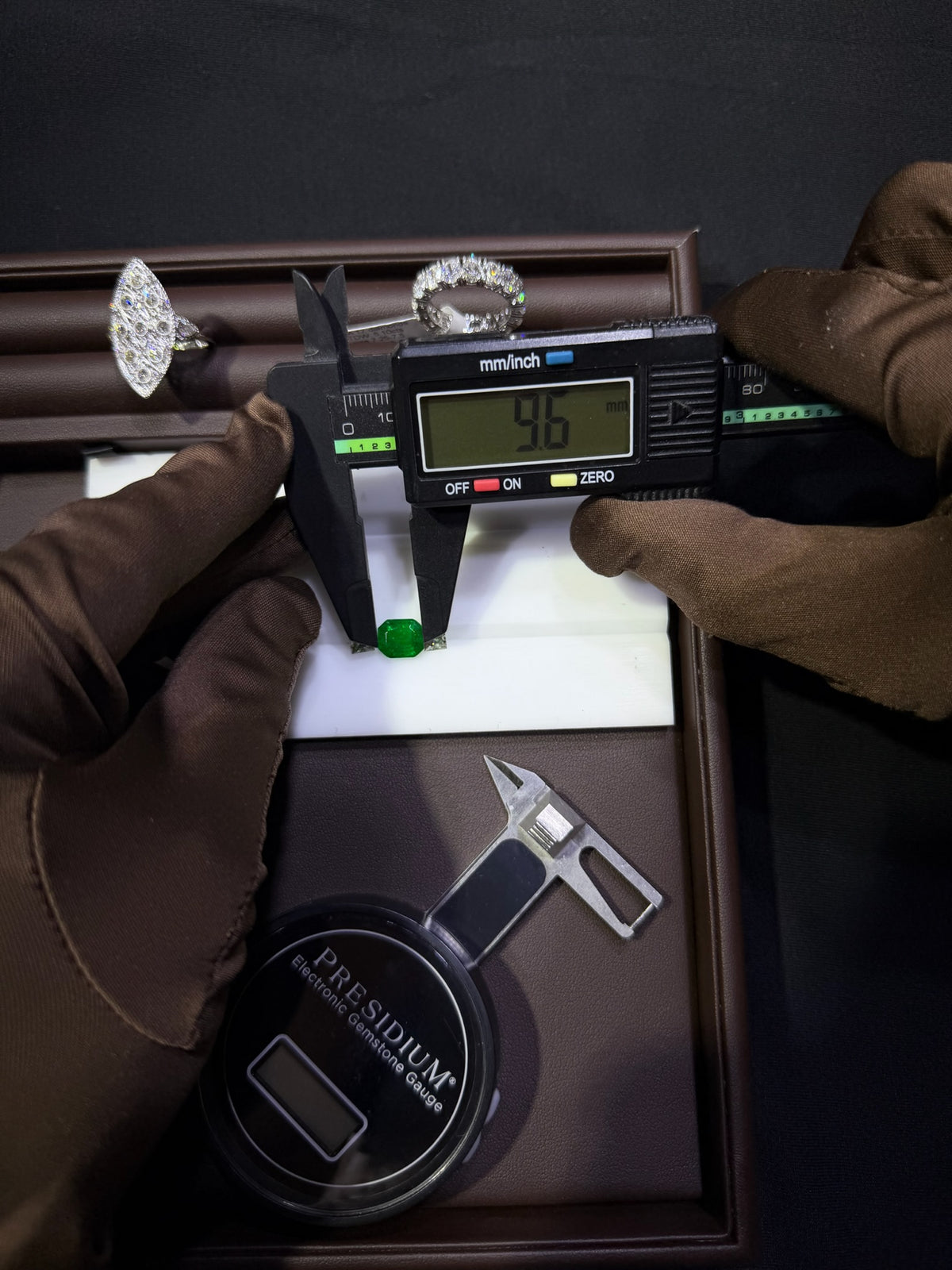 Konstantin Kupfer measuring an emerald with a digital caliper
